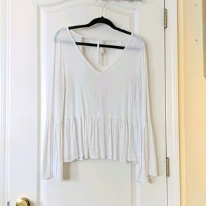 Long sleeve open back blouse.
